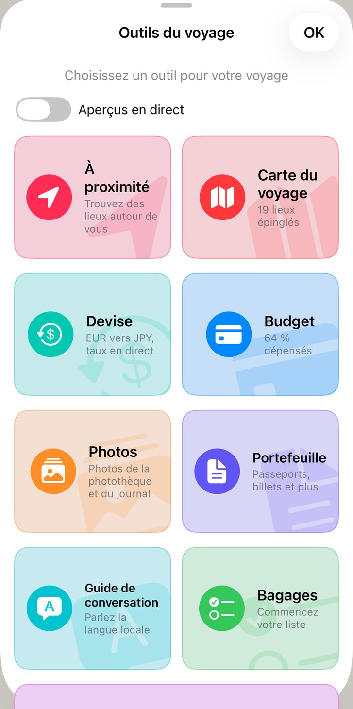 Outils du voyage avec Aperçus en direct activés : tuiles montrant l’itinéraire, le budget, la liste de bagages et les photos